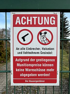 humorous German sign: Beware of trespassing!